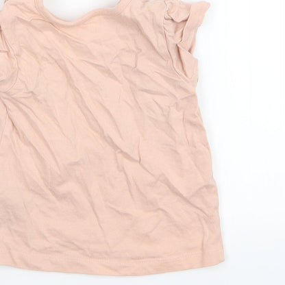 Brand and care label for Nutmeg girls’ pink basic t-shirt, size 3-6, months
