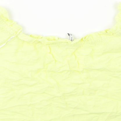 Brand and care label for Bershka women’s yellow basic blouse, size M