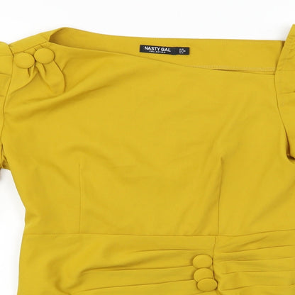 Close-up detail of Nasty Gal women’s yellow basic blouse, size UK 8