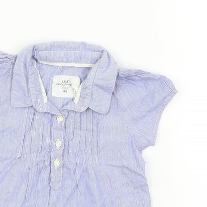 Close-up detail of H&M girls’ blue fit & flare, size 6-9, months