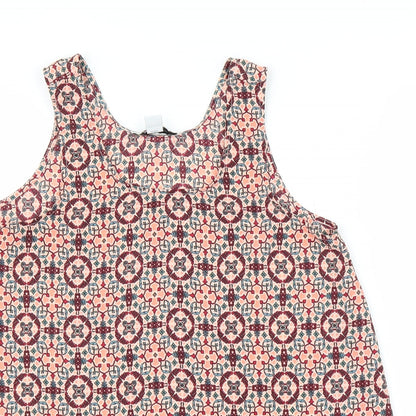 Close-up detail of Primark women’s orange geometric basic blouse, size UK 8