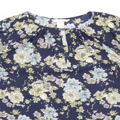 Close-up detail of H&M women’s blue floral basic blouse, size UK 8