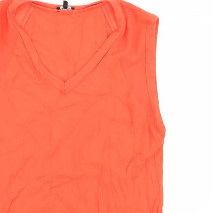 Close-up detail of Warehouse women’s orange basic blouse, size UK 10