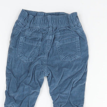 Brand and care label for Holly Willoughby boys’ blue cargo trousers, size 0-3, months