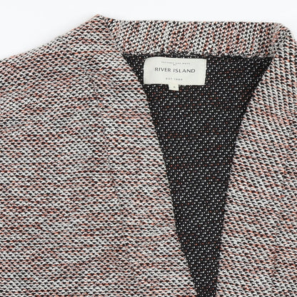 Close-up detail of River Island women’s red jacket, size UK 8