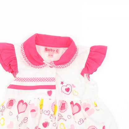 Close-up detail of Baby C Baby Pink Shift, size 12-18, Months - Hearts