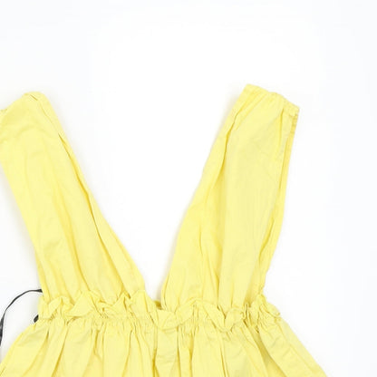 Close-up detail of Missguided women’s yellow basic blouse, size UK 6