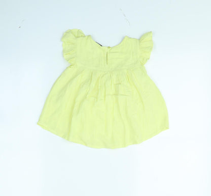 Back view of Evie girls’ yellow basic blouse, size 2, years