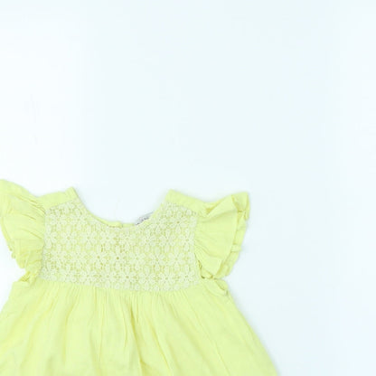 Close-up detail of Evie girls’ yellow basic blouse, size 2, years