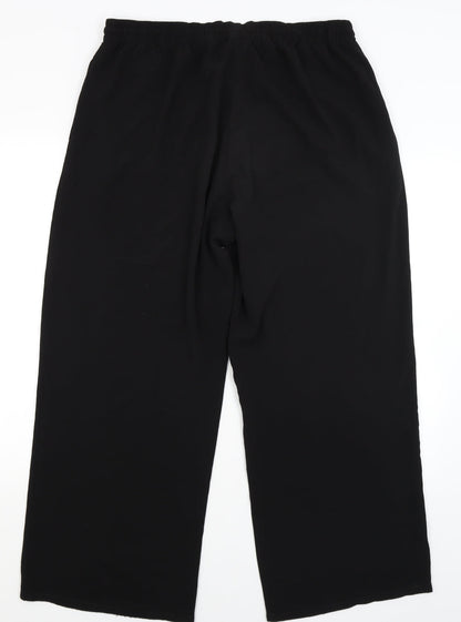 Back view of Papaya women’s black trousers, size UK 16, 28-inch leg