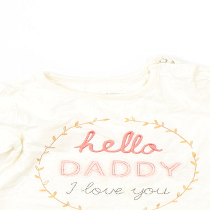 Close-up detail of Nutmeg girls’ ivory basic t-shirt, size 9-12, months