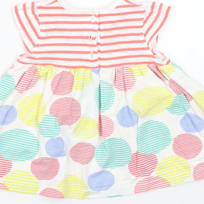 Brand and care label for Mothercare girls’ white striped basic t-shirt, size 3-6, months