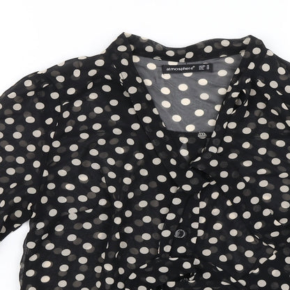 Close-up detail of Atmosphere women’s black polka dot basic blouse, size UK 10