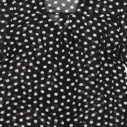 Brand and care label for Atmosphere women’s black polka dot basic blouse, size UK 10