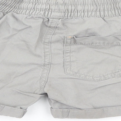 Brand and care label for F&F boys’ grey cargo trousers, size 12-18, months