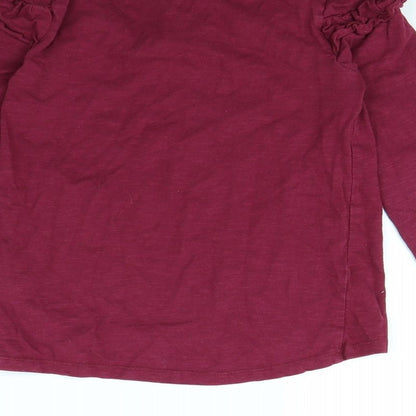 Brand and care label for Nutmeg girls’ purple basic t-shirt, size 8, years