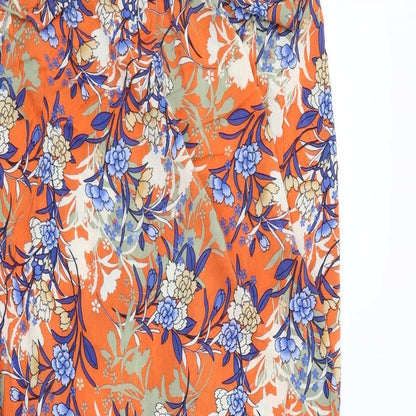 Close-up detail of ASOS women’s orange floral fit & flare, size UK 12