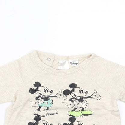Close-up detail of H&M girls’ beige basic t-shirt, size 3-6, months - mickey mouse