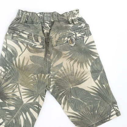 Brand and care label for TU boys’ green floral denim bermuda shorts, size 5, years