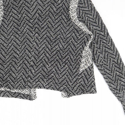 Brand and care label for Miss Selfridge women’s black herringbone jacket, size UK 12