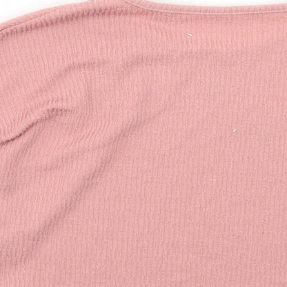 Brand and care label for Nutmeg girls’ pink basic blouse, size 5-6, years