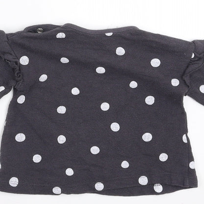 Brand and care label for George girls’ grey polka dot jumper, size 0-3, months