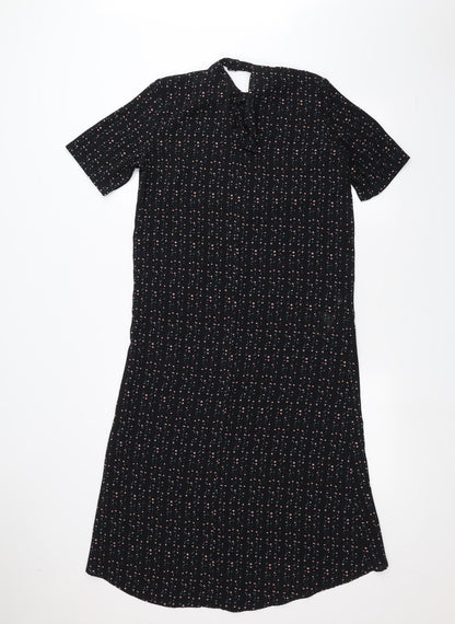 Back view of JDY women’s black polka dot a-line, size UK 6
