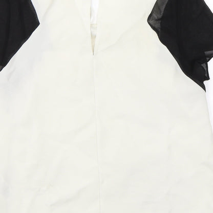 Brand and care label for Miss Selfridge women’s white basic blouse, size UK 6