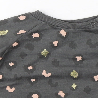 Close-up detail of Primark girls’ grey animal print jumper, size 3-6, months