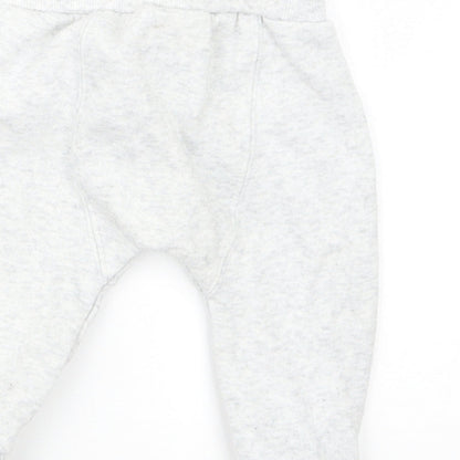 Brand and care label for F&F boys’ grey jogger trousers, size 3-6, months
