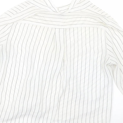 Brand and care label for Atmosphere women’s white striped basic blouse, size UK 14