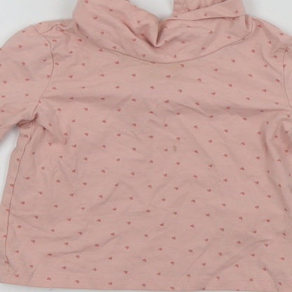Brand and care label for Primark girls’ pink basic t-shirt, size 9-12, months