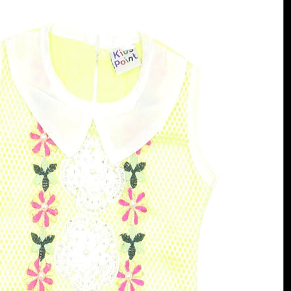 Close-up detail of Preworn girls’ yellow floral basic blouse, size 2-3, years