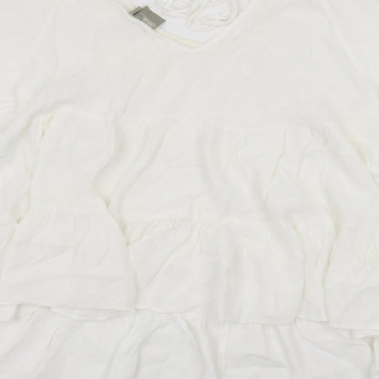 Brand and care label for ASOS women’s white basic t-shirt, size UK 8