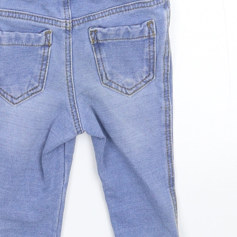 Brand and care label for Denim & Co. girls’ blue denim capri jeans, size 6-9, months