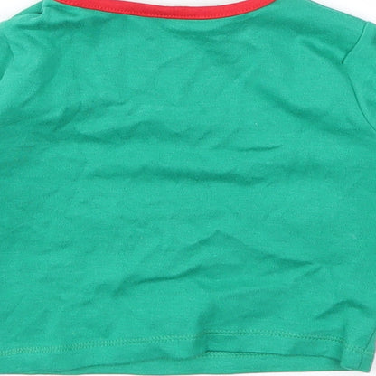 Brand and care label for F&F girls’ green basic t-shirt, size 0-3, months