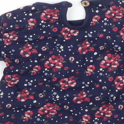 Brand and care label for F&F girls’ blue floral basic t-shirt, size 0-3, months