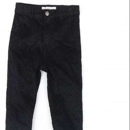 Close-up detail of Denim & Co. girls’ black skinny jeans, size 8, years