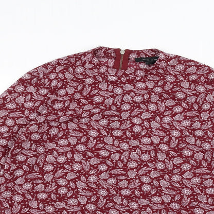Close-up detail of Atmosphere women’s red basic blouse, size UK 10