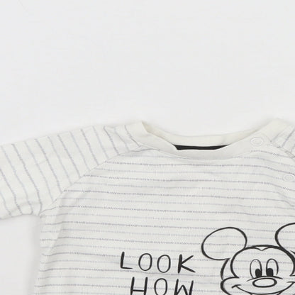 Close-up detail of Disney girls’ white jumper, size 6-9, months