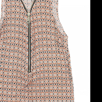 Close-up detail of Izabel women’s orange batik a-line, size UK 14