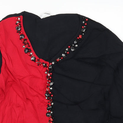 Close-up detail of Roman women’s red knit jumper, size M, - colour block
