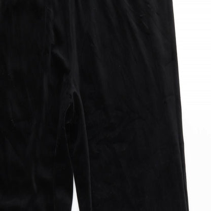 Brand and care label for Canda women’s black sweatpants, size UK 16, 25-inch leg