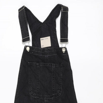Close-up detail of ASOS women’s black a-line, size UK 8