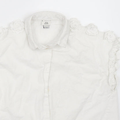 Close-up detail of River Island girls’ white basic button-up, size 7-8, years