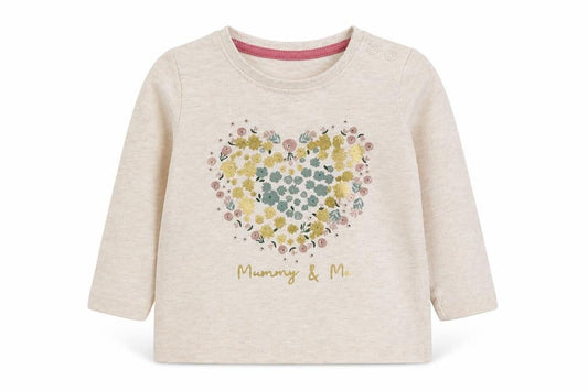 Front view of Primark girls’ beige basic t-shirt, size 6-9, months