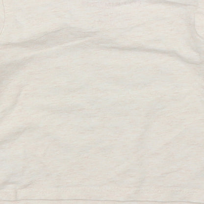 Brand and care label for Primark girls’ beige basic t-shirt, size 6-9, months