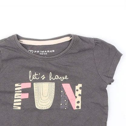 Close-up detail of Primark girls’ grey basic t-shirt, size 9-12, months