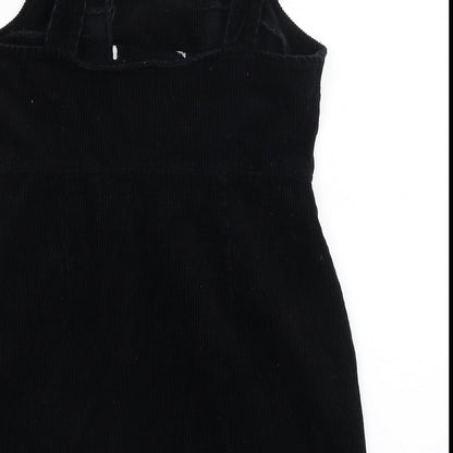 Brand and care label for Miss Selfridge women’s black basic tank, size UK 10
