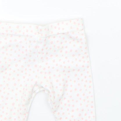 Close-up detail of Disney girls’ white polka dot pyjama pants, size 3-6, months